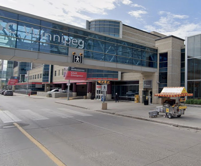 Winnipeg hospital entrance with ambulance and adult emergency signs