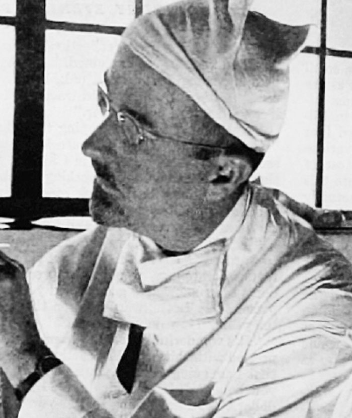 Historic black and white photo of doctor in surgical attire in unsettling rabbit holes