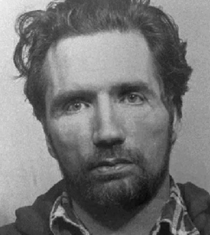 Black and white photo of a rugged man, associated with shocking serial killer facts