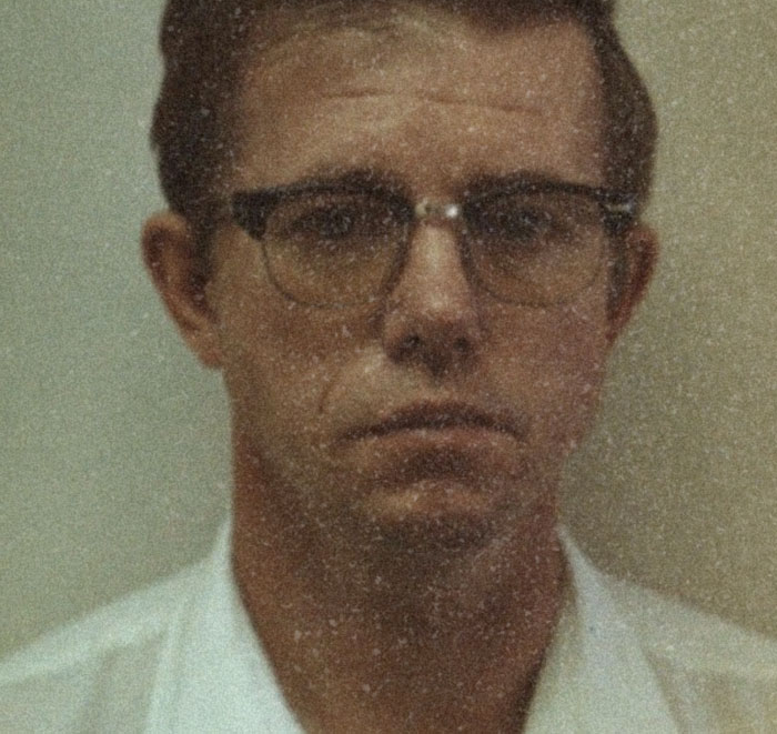 Vintage photo of a man wearing glasses, related to shocking facts about serial killers