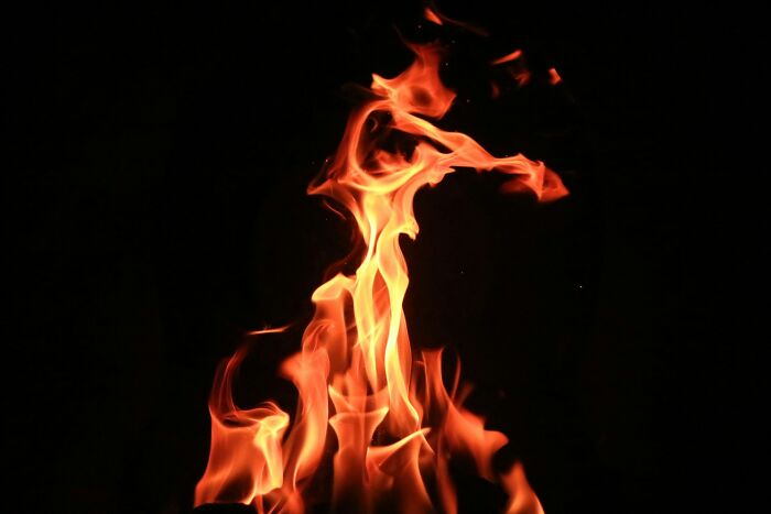 Fire flames against black background symbolizing wedding celebration wedding photography