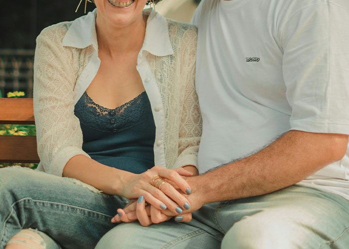 Couple holding hands representing secrets found accidentally