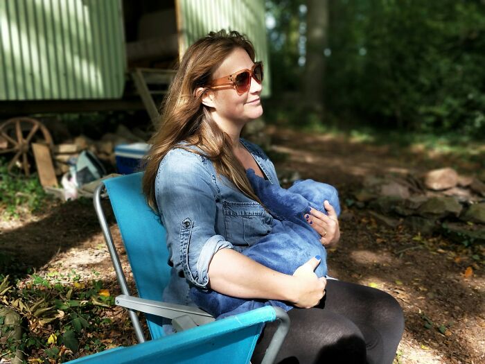 Woman with sunglasses holds a baby, enjoying nature. Scientific facts can be mind-blowing.