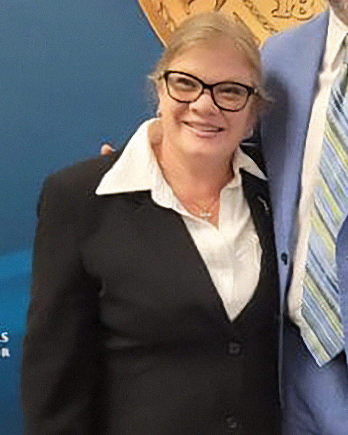Christian mom in glasses posing with man in suit Christian mom in glasses posing with man in suit