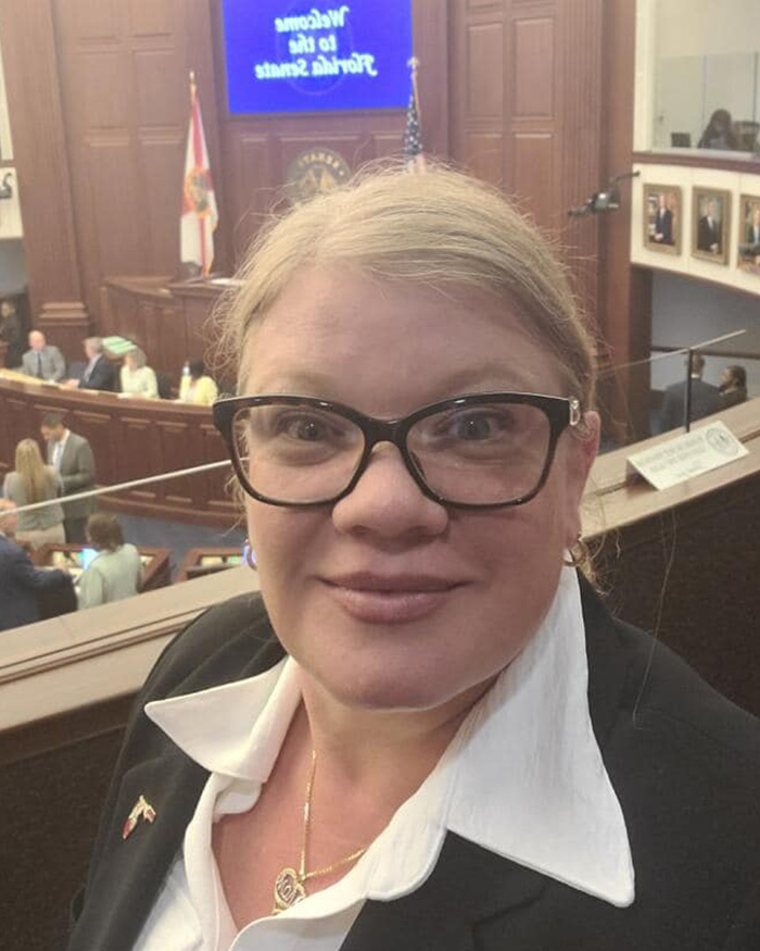 Christian mom wearing glasses at official government building Christian mom wearing glasses at official government building