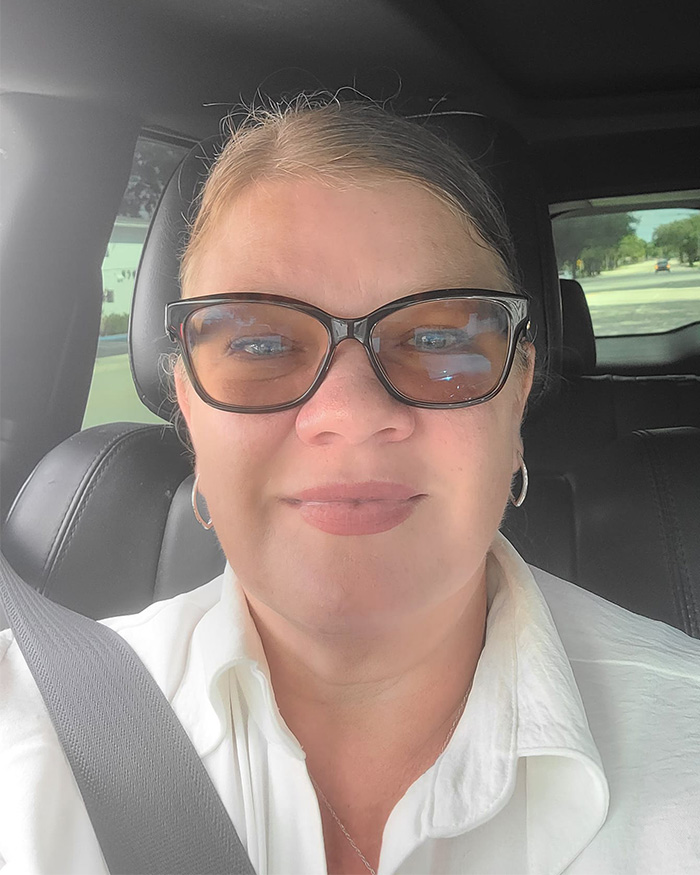 Close-up of Christian mom wearing glasses in car with seatbelt Close-up of Christian mom wearing glasses in car with seatbelt