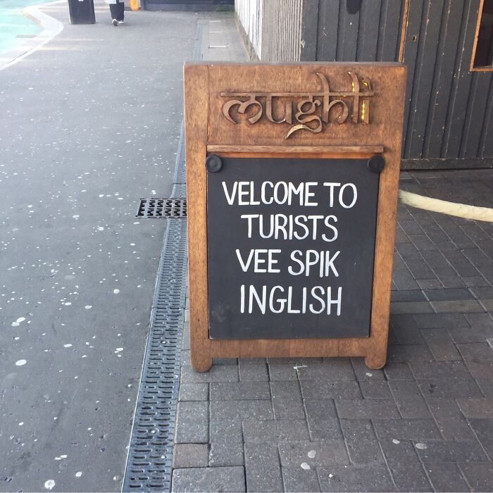 British humorous sign welcoming tourists who speak English