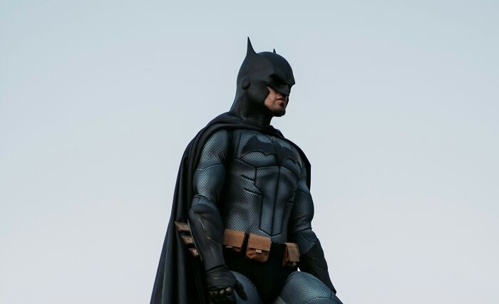 Person dressed as Batman representing unique geography facts