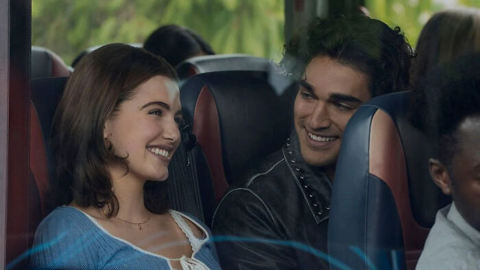 Off Campus actors smiling together on a bus Off Campus actors smiling together on a bus