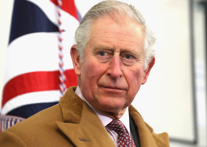 Portrait of King Charles with British flag in background Portrait of King Charles with British flag in background