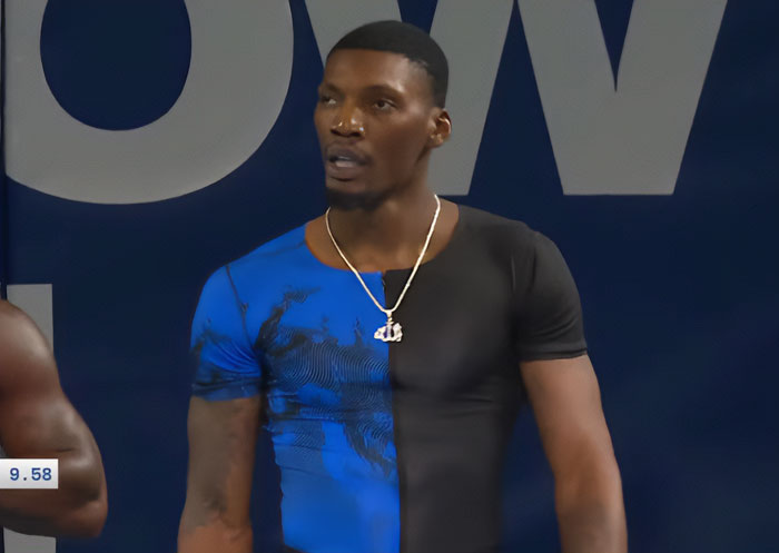Athlete at Steroid Olympics wearing half blue half black shirt looking focused