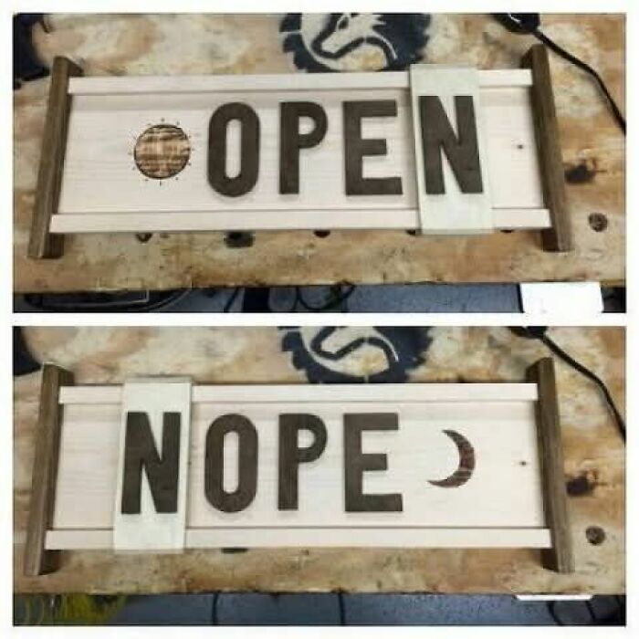 Wooden sign that can flip between open and nope states