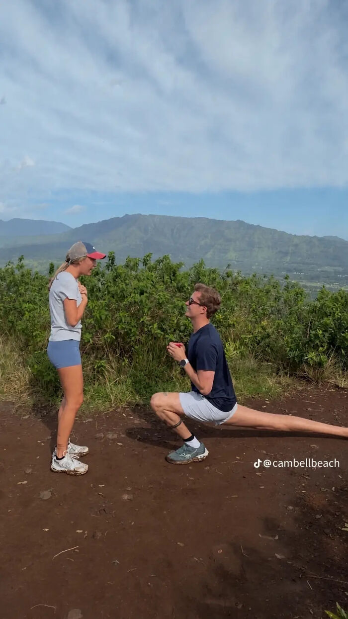 Man proposing to woman in a picturesque setting. Her excited reaction to the proposal pic sparked hilarious edits.