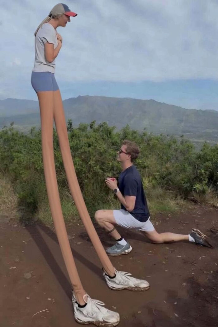 Man proposing to a woman with hilariously long legs. This proposal pic has inspired funny edits.