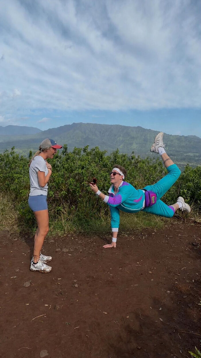 Woman's proposal pic on a mountain. A man in an 80s tracksuit proposes to a woman. Hilarious edits.