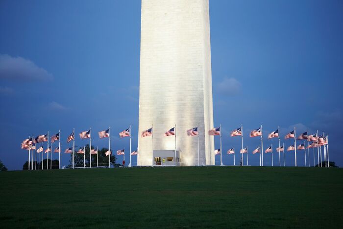 Washington Monument surrounded by flags representing favorite shocking facts about landmarks
