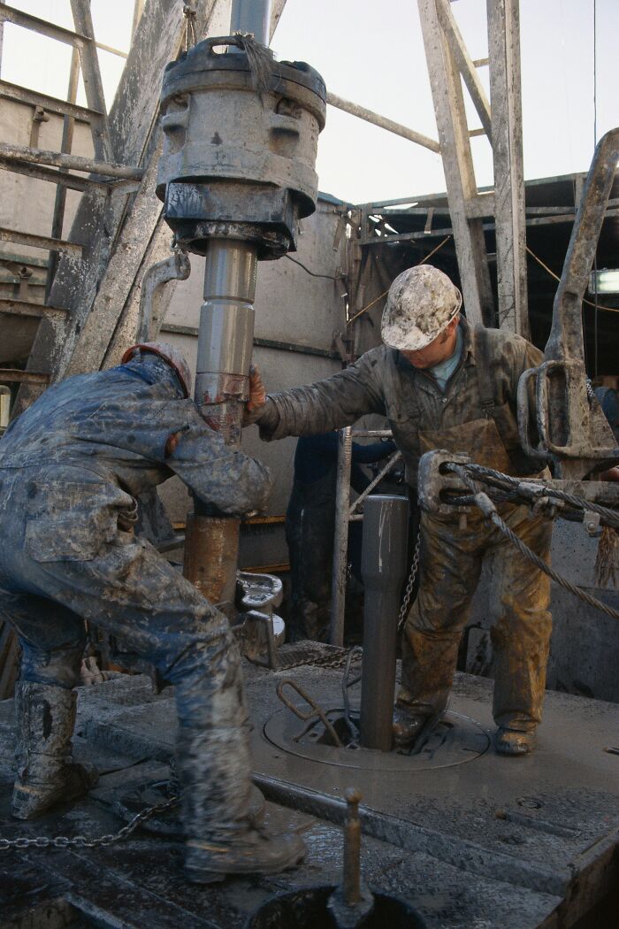 Workers operating heavy machinery at a construction career site