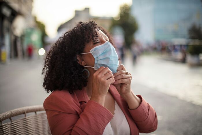 Woman wearing protective face mask outdoors