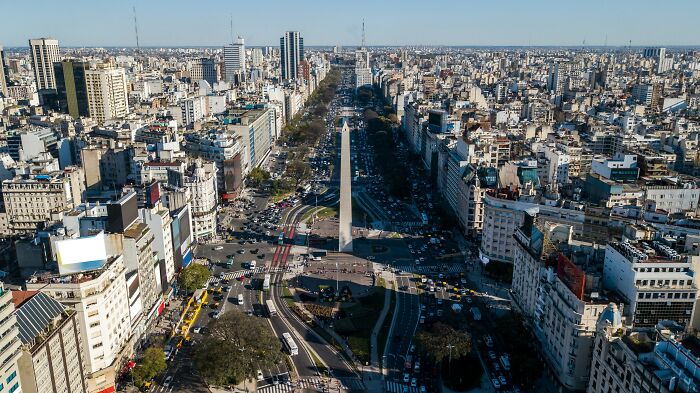 Aerial view of city with prominent obelisk landmark in urban geography