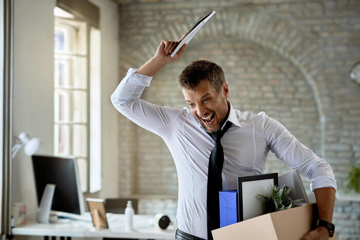 Angry man at office ready to cause unexpected disaster