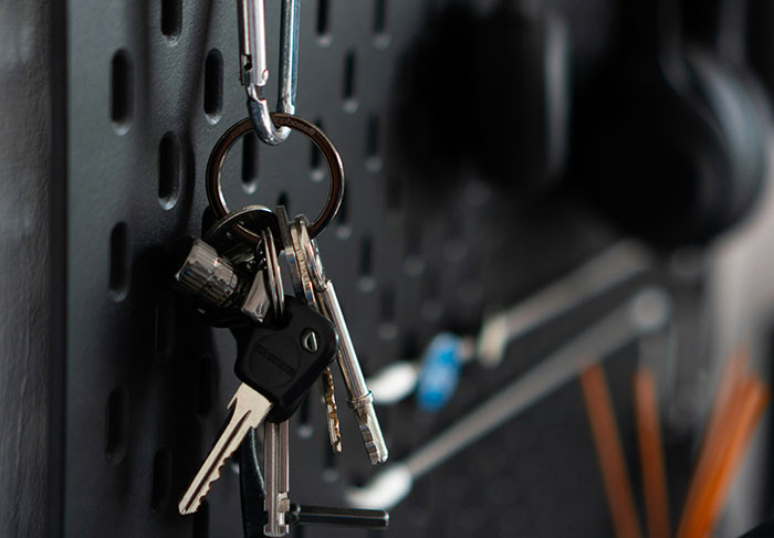 Keys hanging on a board, symbolizing landlord control over rental property access