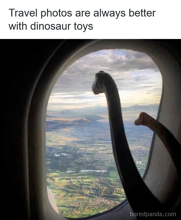 A funny travel meme featuring two dinosaur toys peeking out of an airplane window at a scenic landscape below.