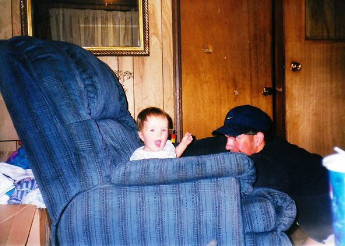 Child and man in living room with creepy photo illusion