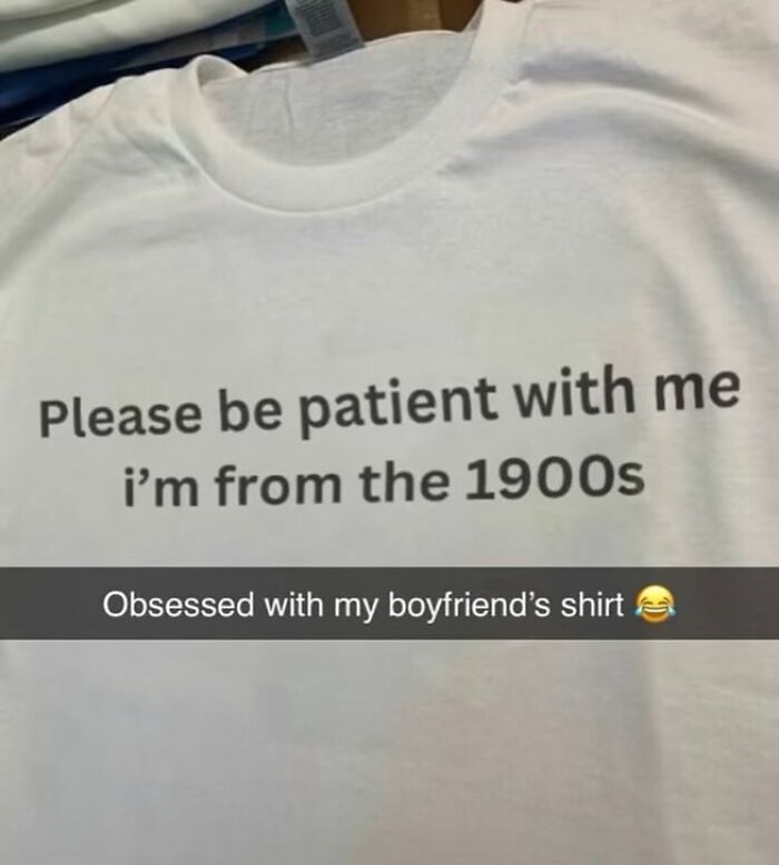 A close-up of a white t-shirt with black text that reads, Please be patient with me I'm from the 1900s, reflecting brilliant t-shirts.
