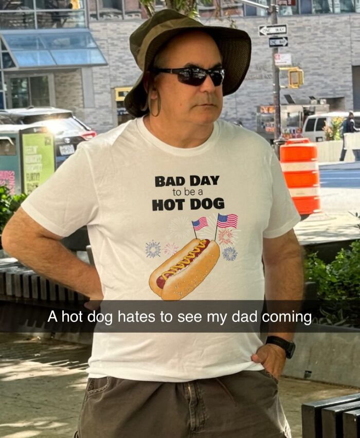 A man wearing a white t-shirt with a hot dog graphic and the text BAD DAY to be a HOT DOG, a brilliant t-shirt.