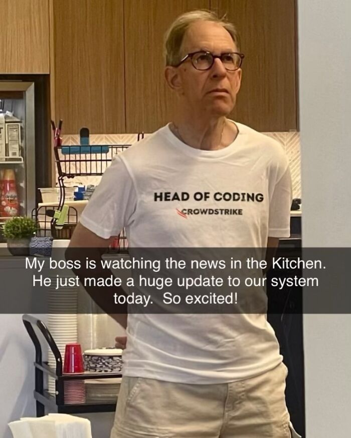 A man wearing brilliant T-shirts in a kitchen with the text HEAD OF CODING on it, bizarre and unhinged.