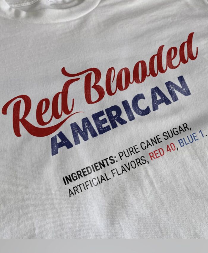 A white T-shirt with the text Red Blooded American and a list of ingredients, presenting a unique and bizarre T-shirt design.