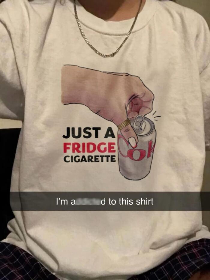 A person wearing a white T-shirt with the text Just a Fridge Cigarette and an image of a hand opening a soda can, illustrating brilliant and bizarre T-shirts.