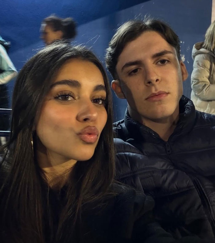 Normal guy and influencer girlfriend taking a selfie together at night Normal guy and influencer girlfriend taking a selfie together at night