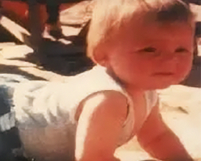 Missing child crawling outdoors in vintage image