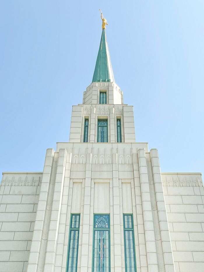 White religious temple building with blue sky relating to cult escape locations