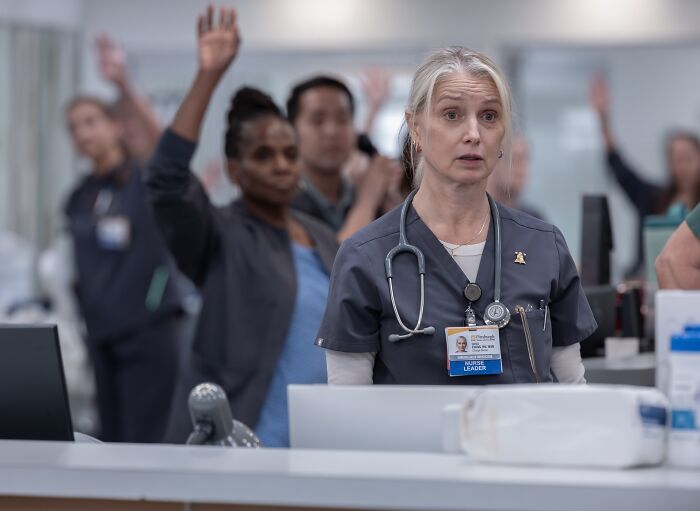 Nurse leader and team raising hands in The Pitt hospital scene Nurse leader and team raising hands in The Pitt hospital scene