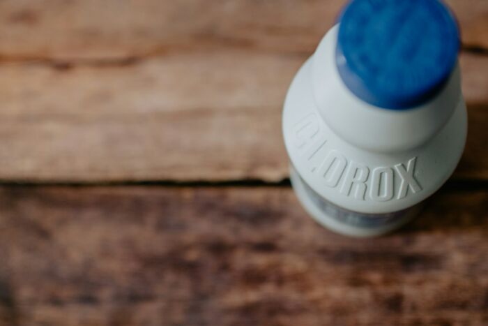 Top view of Clorox bleach bottle on wooden surface