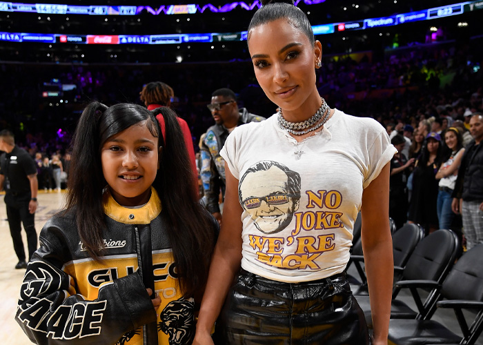 Kim Kardashian and North West at a basketball game Kim Kardashian and North West at a basketball game