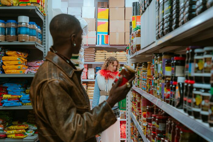 Shoppers in grocery aisle appearing unaware in January 6 context