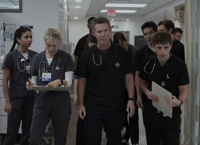 The Pitt cast portraying medical staff walking through hospital corridor The Pitt cast portraying medical staff walking through hospital corridor