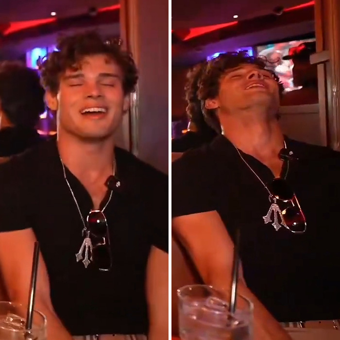 Looksmaxxing influencer Clavicular smiling and laughing in casual black shirt at a bar Looksmaxxing influencer Clavicular smiling and laughing in casual black shirt at a bar