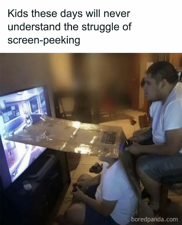 Man using cardboard shield to block screen view while gaming ridiculous memes