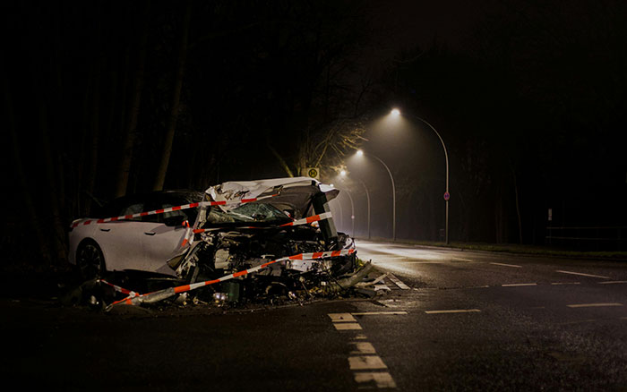 Messed up school stories might make you appreciate your younger years. A wrecked white car at night on a dark road.