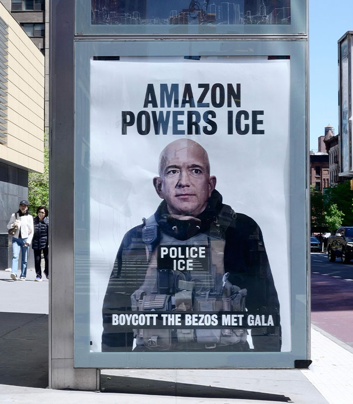 A street poster depicts Jeff Bezos in a police vest, promoting MET Gala protesting acts. Text says "Amazon Powers ICE" and "Boycott the Bezos Met Gala."