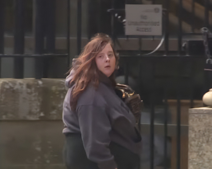 Woman with handbag outside courthouse after sentencing