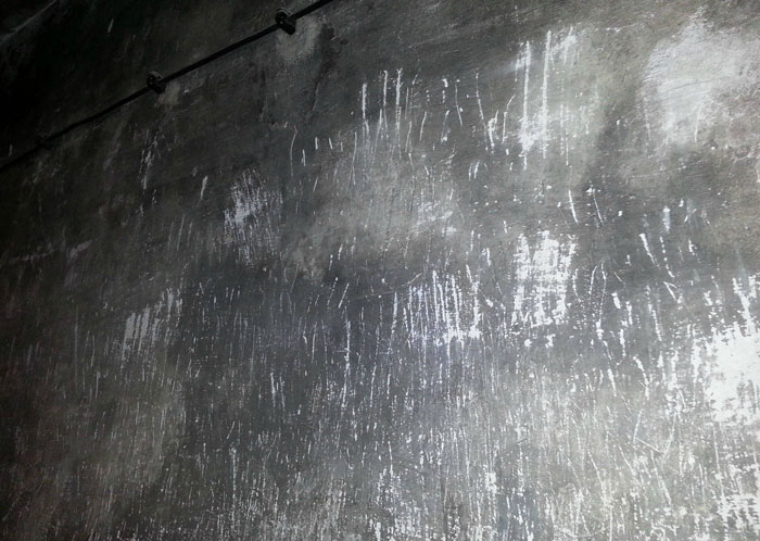 Wall with scratch marks representing powerful images of resilience