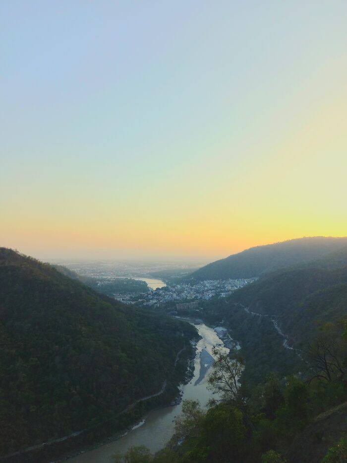 Scenic river valley surrounded by hills at sunrise in random incredible photos