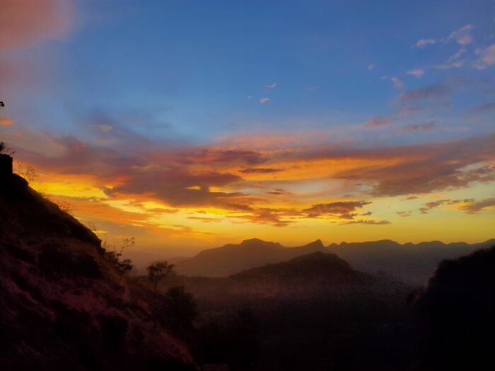 Incredible sunset photo capturing colorful sky and mountain silhouette in random camera clicks