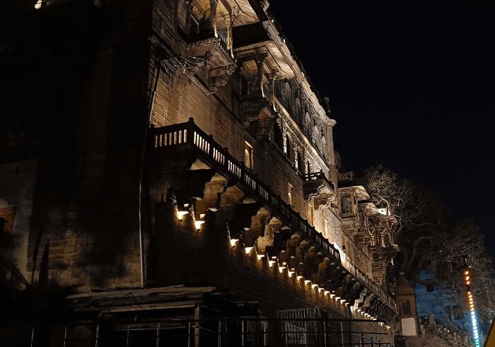 Night view of an illuminated ancient building captured in a random camera click
