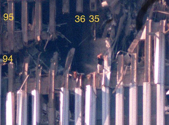 People seen on damaged building beams after disaster